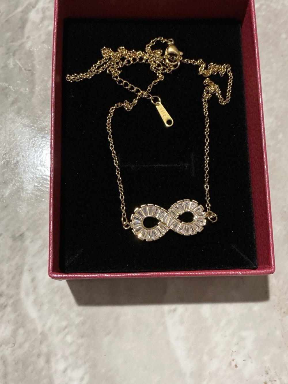 Gold-tone Infinity Pendant Necklace with Clear Stones